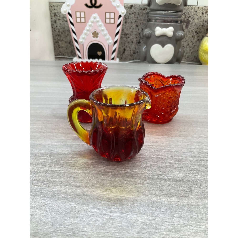 DEGENHART GLASS MINI CREAMER PITCHER AND TWO RUBY RED TOOTHPICK HOLDERS